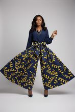 African model wearing extra wide navy and yellow palazzo pants
