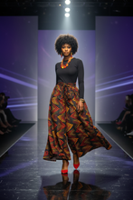 African model wearing Zuri Ember Wide-Leg Palazzo Pants on runway